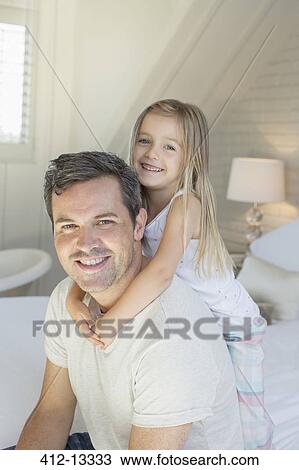 Father and daughter hugging on bed View Large Photo Image Stock Image - Father and daughter hugging on bed. Fotosearch