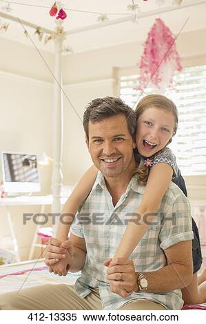 Father and daughter hugging on bed View Large Photo Image Stock Photography - Father and daughter hugging on bed. Fotosearch