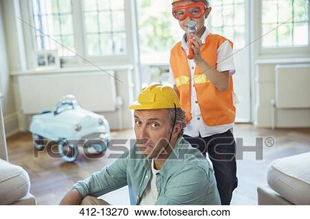 Father and son playing with construction toys View Large Photo Image Stock Image - Father and son playing with construction toys. Fotosearch