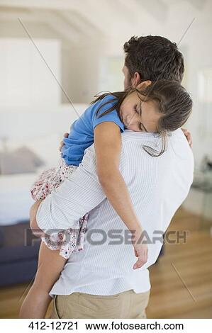 Father carrying sleeping daughter in bedroom View Large Photo Image Stock Image - Father carrying sleeping daughter in bedroom. Fotosearch