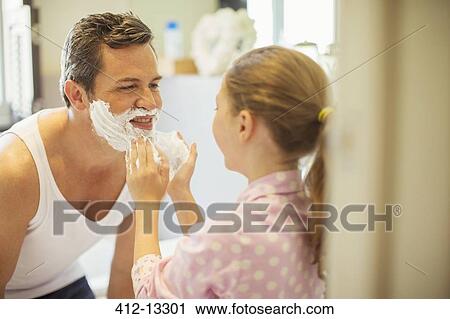 Girl rubbing shaving cream on father's face View Large Photo Image Stock Image - Girl rubbing shaving cream on father's face. Fotosearch
