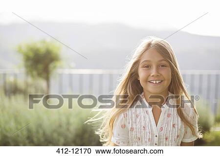 Girl smiling outdoors View Large Photo Image Stock Image - Girl smiling outdoors. Fotosearch