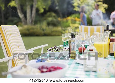 Lunch on table in backyard View Large Photo Image Stock Image - Lunch on table in backyard. Fotosearch