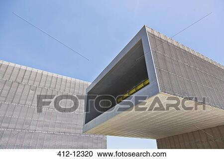 Stock Image - Modern building with glass wall. Fotosearch