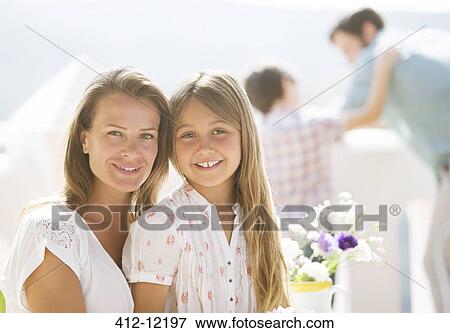Mother and daughter smiling outdoors View Large Photo Image Stock Photo - Mother and daughter smiling outdoors. Fotosearch