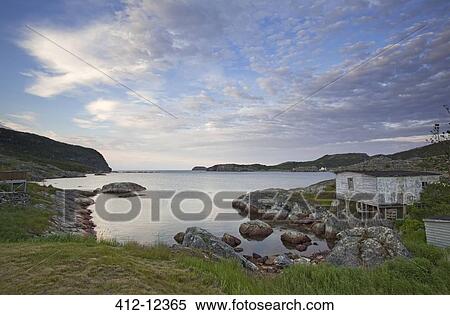 Rocks along calm bay View Large Photo Image Stock Photography - Rocks along calm bay. Fotosearch