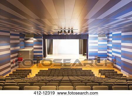 Stock Photo - Seating and stage in empty auditorium. Fotosearch