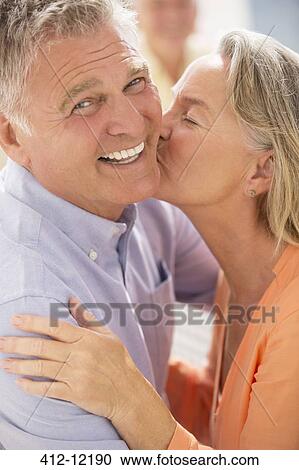 Senior couple kissing View Large Photo Image Stock Image - Senior couple kissing. Fotosearch