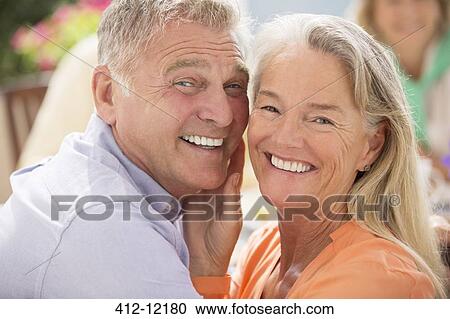 Senior couple smiling outdoors View Large Photo Image Stock Image - Senior couple smiling outdoors. Fotosearch
