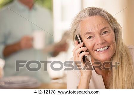 Senior woman talking on cell phone View Large Photo Image Stock Photo - Senior woman talking on cell phone. Fotosearch