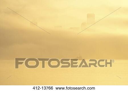 Silhouette of tugboat and fog over city skyline View Large Photo Image Stock Photograph - Silhouette of tugboat and fog over city skyline. Fotosearch