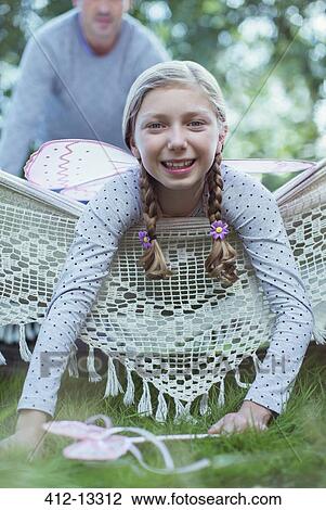 Smiling girl laying in hammock View Large Photo Image Stock Image - Smiling girl laying in hammock. Fotosearch