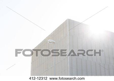 Stock Image - Sun shining over modern building. Fotosearch