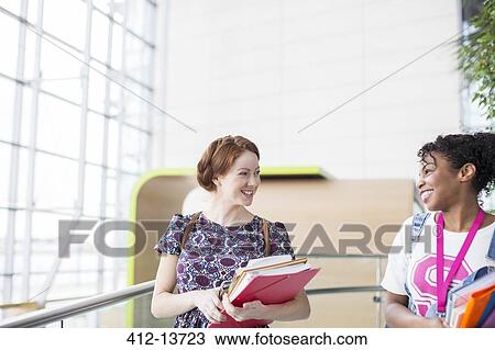 University students talking indoors View Large Photo Image Stock Image - University students talking indoors. Fotosearch