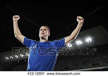 Soccer player cheering in stadium View Large Photo Image Stock Image - Soccer player cheering in stadium. Fotosearch