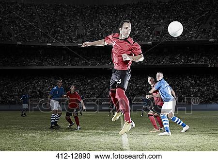 Soccer player jumping on field View Large Photo Image Stock Image - Soccer player jumping on field. Fotosearch