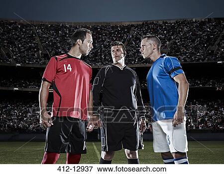 Soccer players facing each other on field View Large Photo Image Stock Photo - Soccer players facing each other on field. Fotosearch