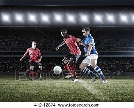 Soccer players with ball on field View Large Photo Image Picture - Soccer players with ball on field. Fotosearch