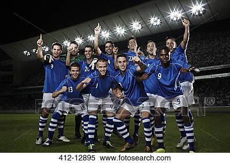 Soccer team cheering on field View Large Photo Image Stock Photography - Soccer team cheering on field. Fotosearch