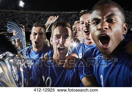 Soccer team cheering on field View Large Photo Image Stock Photography - Soccer team cheering on field. Fotosearch