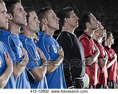 Soccer teams listening to anthem on field View Large Photo Image Stock Image - Soccer teams listening to anthem on field. Fotosearch