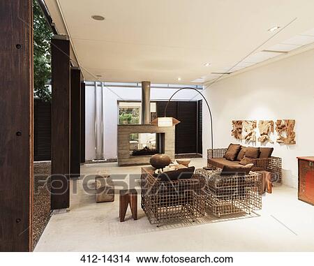 Armchairs and fireplace in modern living room View Large Photo Image Picture - Armchairs and fireplace in modern living room. Fotosearch