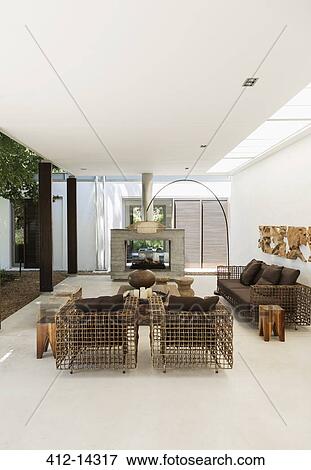 Armchairs and fireplace in modern living room View Large Photo Image Stock Photo - Armchairs and fireplace in modern living room. Fotosearch