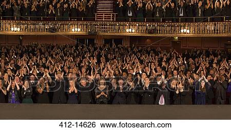 Audience applauding in theater View Large Photo Image Stock Photograph - Audience applauding in theater. Fotosearch