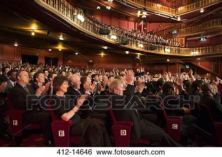 Audience applauding in theater View Large Photo Image Stock Photograph - Audience applauding in theater. Fotosearch