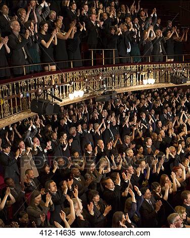 Stock Photography - Audience applauding in theater. Fotosearch