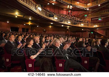 Audience applauding in theater View Large Photo Image Stock Photography - Audience applauding in theater. Fotosearch