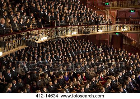 Picture - Audience watching performance in theater. Fotosearch