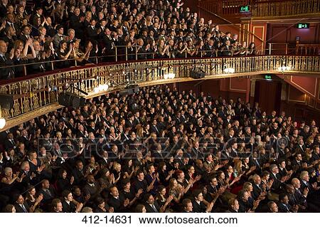 Stock Image - Audience watching performance in theater. Fotosearch