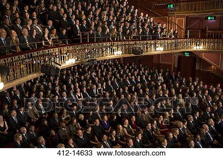 Stock Image - Audience watching performance in theater. Fotosearch