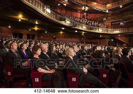 Audience watching performance in theater View Large Photo Image Stock Photo - Audience watching performance in theater. Fotosearch