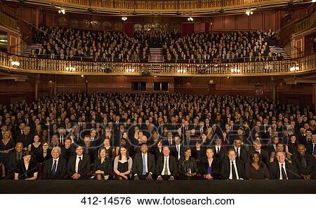 Audience watching performance in theater View Large Photo Image Stock Photograph - Audience watching performance in theater. Fotosearch