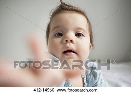 Baby girl reaching out View Large Photo Image Stock Image - Baby girl reaching out. Fotosearch