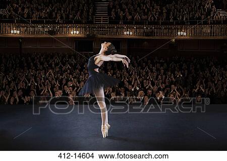 Ballerina performing on stage in theater View Large Photo Image Picture - Ballerina performing on stage in theater. Fotosearch