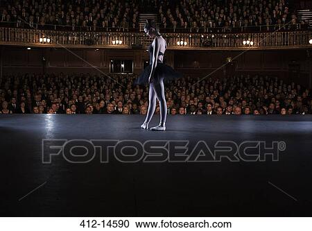 Ballet dancer performing on stage in theater View Large Photo Image Stock Image - Ballet dancer performing on stage in theater. Fotosearch