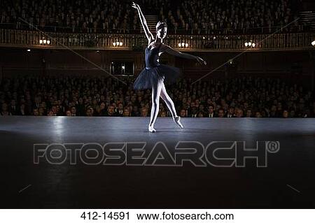Ballet dancer performing on stage in theater View Large Photo Image Stock Image - Ballet dancer performing on stage in theater. Fotosearch