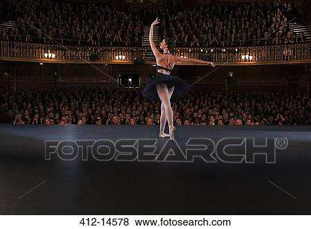Ballet dancer performing on theater stage View Large Photo Image Stock Photo - Ballet dancer performing on theater stage. Fotosearch
