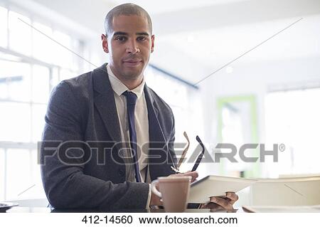 Stock Image - Businessman using digital tablet. Fotosearch