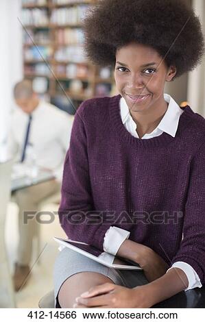 Stock Photograph - Businesswoman using digital tablet. Fotosearch