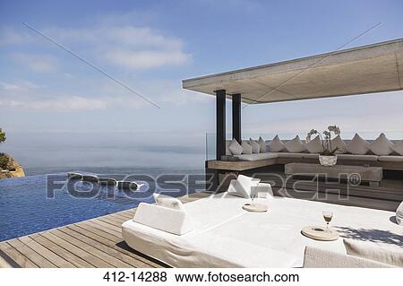 Cabana and infinity pool overlooking ocean View Large Photo Image Stock Photo - Cabana and infinity pool overlooking ocean. Fotosearch