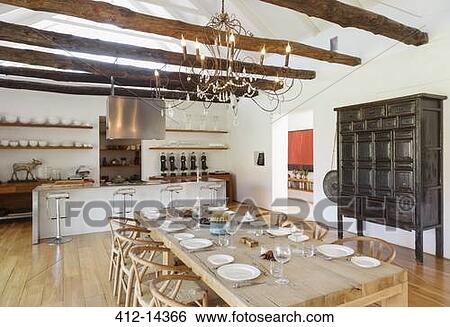 Chandelier over dining room in luxury house View Large Photo Image Stock Photograph - Chandelier over dining room in luxury house. Fotosearch