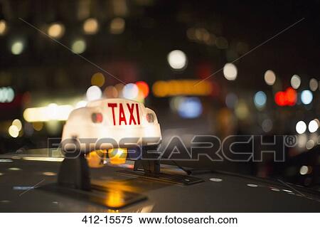 Close up of illuminated Parisian taxi light, Paris, France View Large Photo Image Stock Photography - Close up of illuminated Parisian taxi light, Paris, France. Fotosearch
