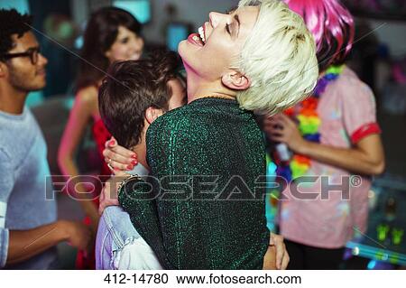 Couple dancing together at party View Large Photo Image Stock Image - Couple dancing together at party. Fotosearch