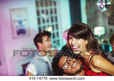 Stock Photo - Couple dancing together at party. Fotosearch