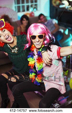 Stock Photo - Couple wearing costumes at party. Fotosearch
