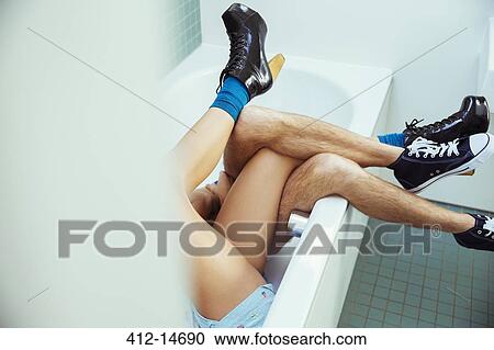 Couple's legs intertwined in bathtub View Large Photo Image Stock Image - Couple's legs intertwined in bathtub. Fotosearch